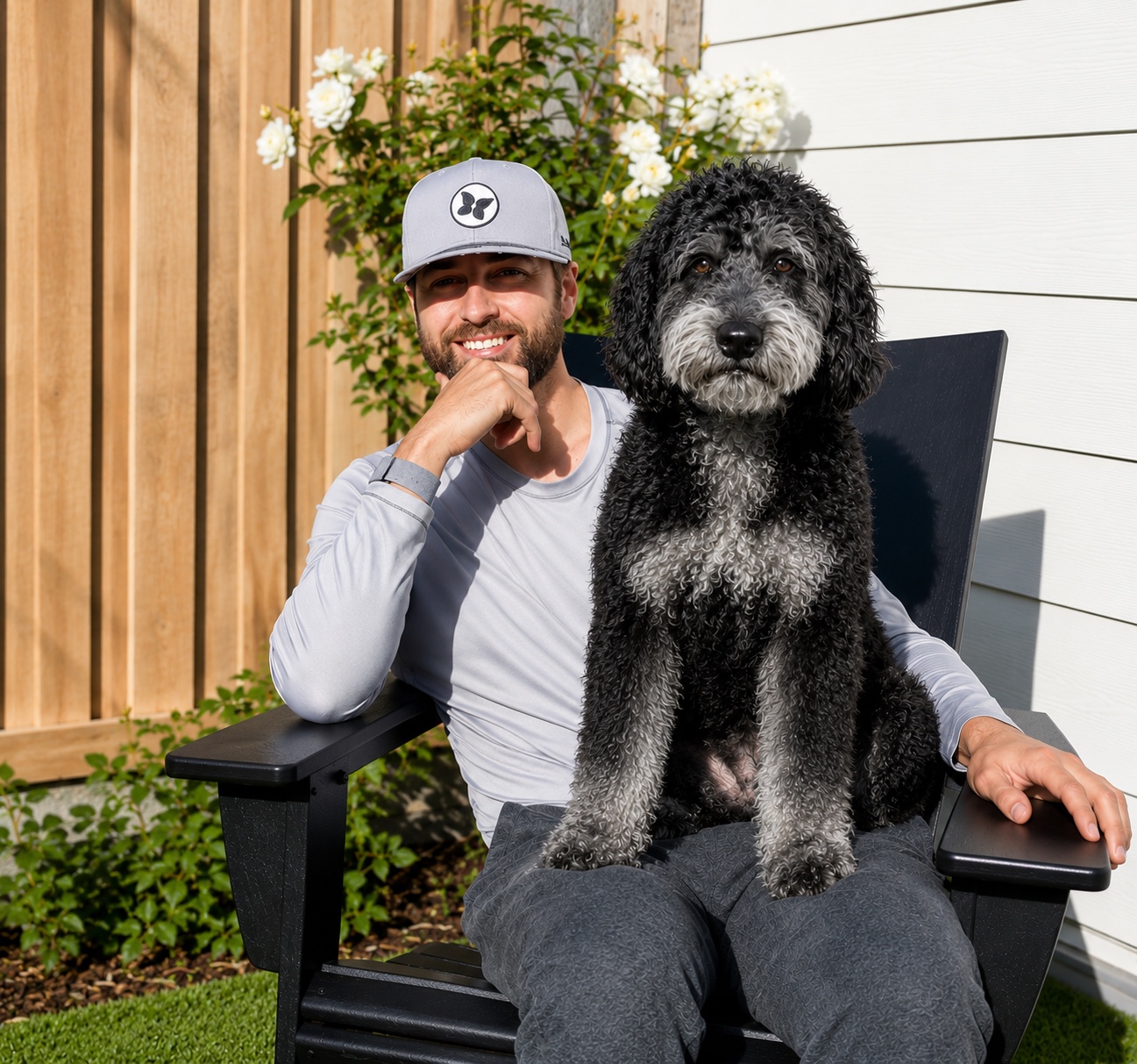 Ryan from Peninsula Pet Concierge sitting with his dog